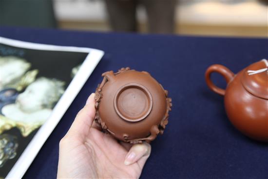 A Chinese Yixing pottery globular teapot and a similar prunus cup, 19th century, 6.5cm